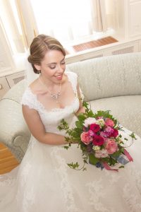 Bride with DIY wedding bouquet in pinks and white