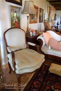 Fauteuil-style antique chair at Coach
