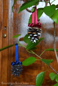 Painted pinecone and ribbon ornaments | flourishandknot.com