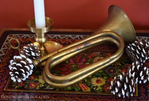 Flourish & Knot's 2015 Christmas Home Tour | flourishandknot.com | Brass trumpet on a red painted tray with pinecones