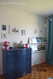 Navy, turquoise, pink, and white Harry Potter nursery with navy dresser | flourishandknot.com