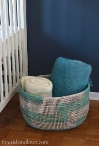 Woven turquoise and white basket from UncommonGoods | flourishandknot.com