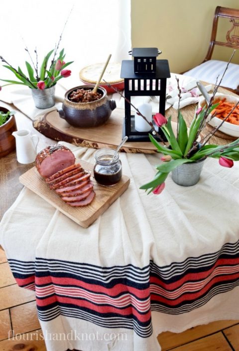 Red, White, and Black table setting with tulips and lantern | Tourtiere (meat pie) | Sugar Shack Lunch | Cabane a sucre menu | A Year of Feasting - Spring | Traditional Canadian Quebec meal