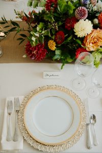 Gold-rimmed charger plate with elegant placecards and late-summer florals | Flourish & Knot | Montreal wedding florist