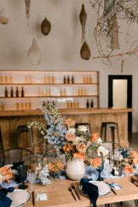Terracotta, orange, blue, and cream wedding table setting | Winter wedding shoot at the Verger du Flanc Nord