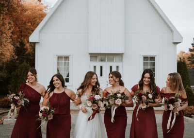 Bride and bridesmaids in burgundy with blush and burgundy bouquets | Flourish & Knot