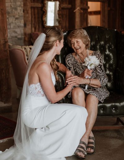 Bride with her grandmother with wired gladiola bouquet