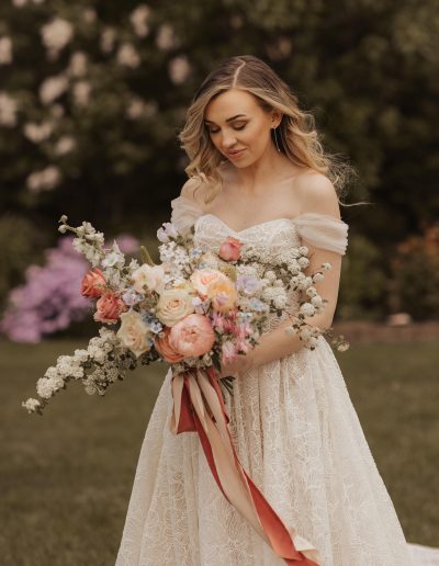 Bride with spring bridal bouquet and silk ribbons | Kerstin Hahn Photography | Flourish & Knot