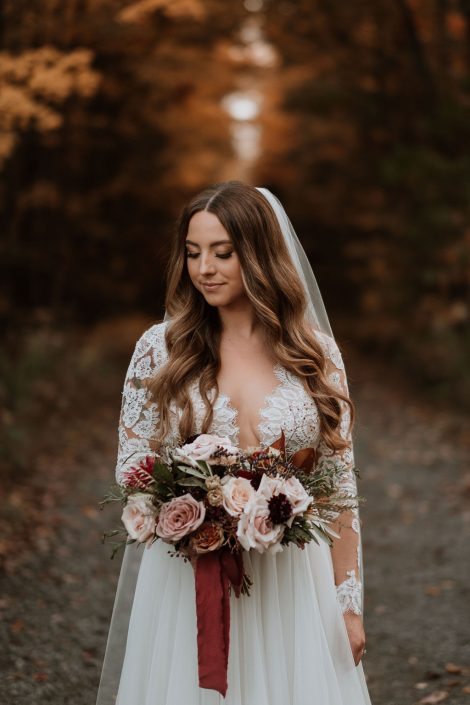 Bride in the fall with blush burgundy and caramel bridal bouquet | Flourish & Knot