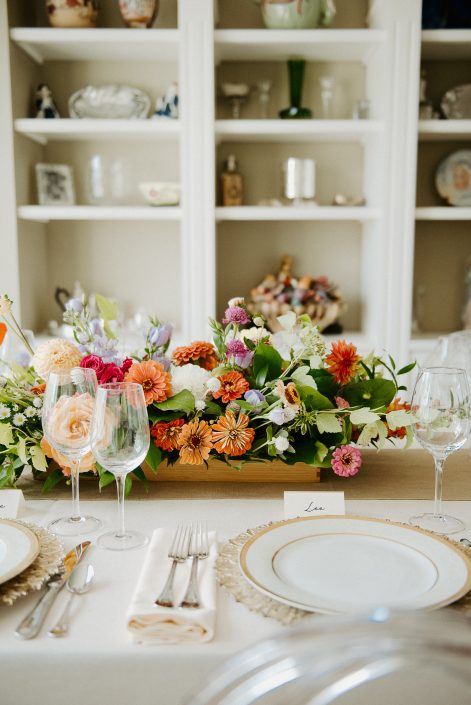 Colourful lush summer wedding centrepiece with dahlias and zinnias | L'Orangerie Photographie | Flourish & Knot