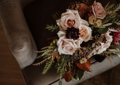 Closeup of bridal bouquet in burgundy and blush | Flourish & Knot