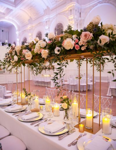 Luxurious wedding florals | Elevated floral runner in pink and white with candles and bud vases at Maison Principal | CEP Studio | Flourish & Knot