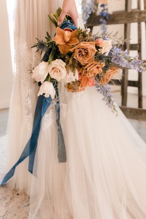Terracotta, caramel, blush, and blue bridal bouquet with blue velvet ribbon | Kerstin Hahn Photography | Flourish & Knot