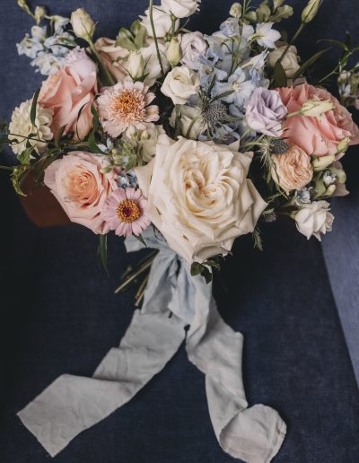 Blush peach coral and pale blue bridal bouquet in garden style | Flourish & Knot