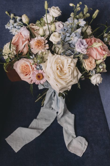 Blush peach coral and pale blue bridal bouquet in garden style | Flourish & Knot