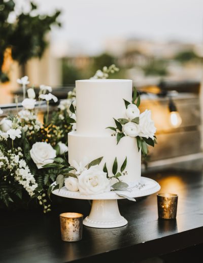 White wedding cake with white and green flowers