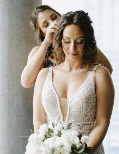 Bride with classic white and green bouquet