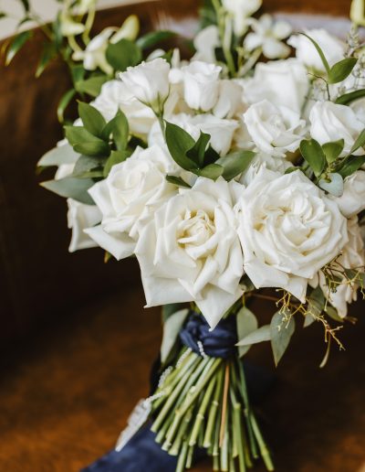 Classic bridal bouquet in white and green with white roses and navy silk ribbon | Flourish & Knot