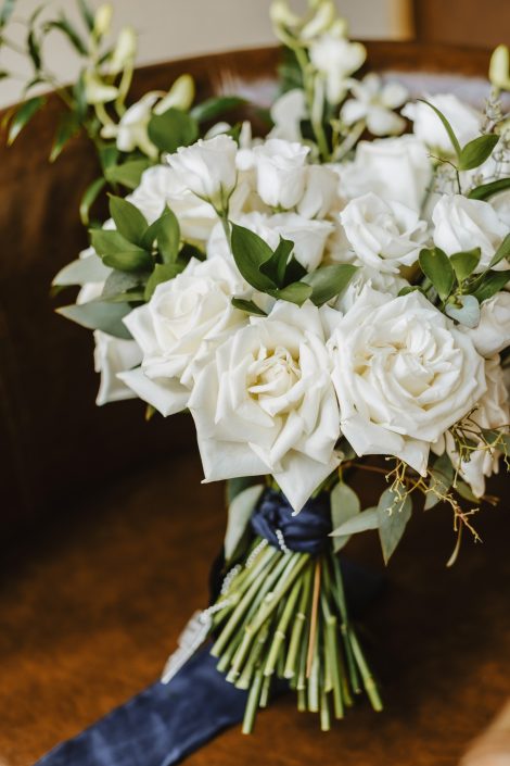 Classic bridal bouquet in white and green with white roses and navy silk ribbon | Flourish & Knot