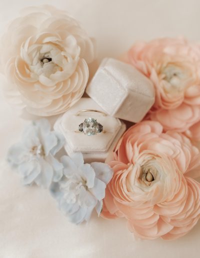 Pale blue engagement ring by Loft Bijoux with peach and blue flowers | Kerstin Hahn Photography | Flourish & Knot