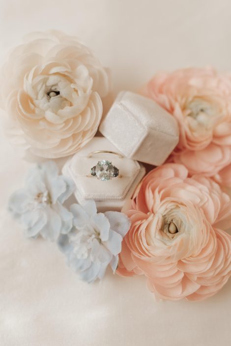 Pale blue engagement ring by Loft Bijoux with peach and blue flowers | Kerstin Hahn Photography | Flourish & Knot