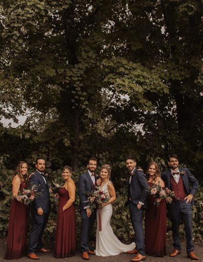 Wedding party in navy and burgundy with bouquets in forest | Kerstin Hahn Photography | La Bullerie | Flourish & Knot