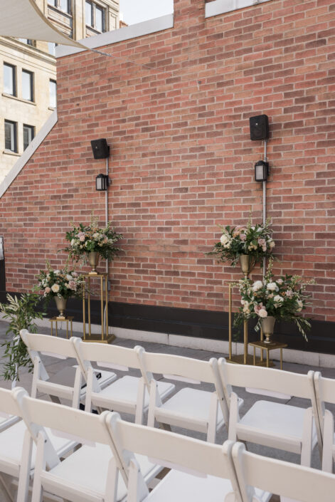 Wedding ceremony at Hotel Place D'Armes in Montreal's Old port | Tiered large floral arrangements for wedding ceremony | Flourish & Knot | Montreal wedding florist | Hotel Place D'Armes wedding | Montreal Old Port Wedding