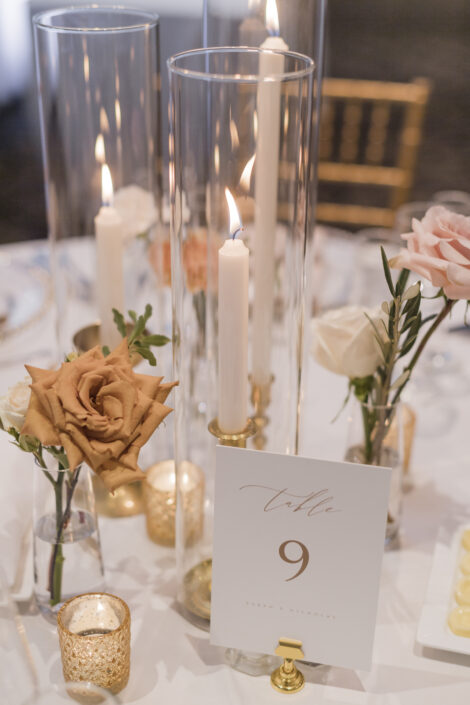 Candlestick and bud vase centrepiece with vintage brass candlesticks and a warmly neutral colour palette incorporating toffee roses | Flourish & Knot | Montreal wedding florist | Hotel Place D'Armes wedding | Montreal Old Port Wedding